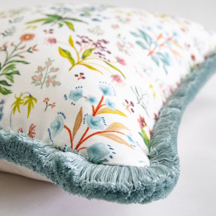 multicolor floral pillow with brush fringe