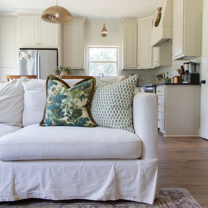 jasper grace willow pillow and jasper Devonshire green pillow on cream sofa