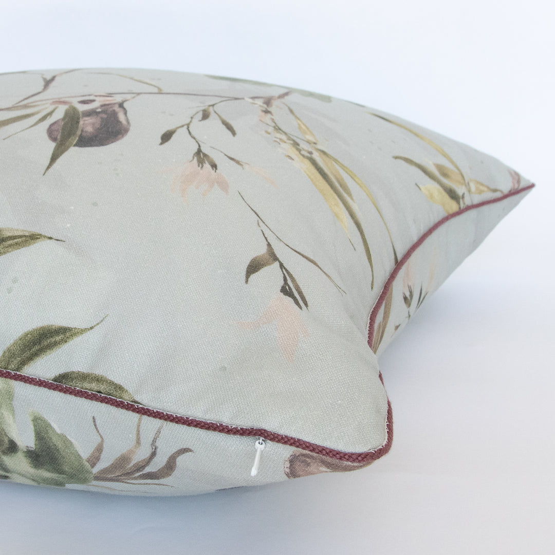 light blue watercolor botanical fig pillow with purple contrast cording