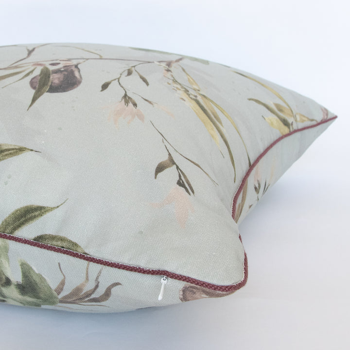 light blue watercolor botanical fig pillow with purple contrast cording