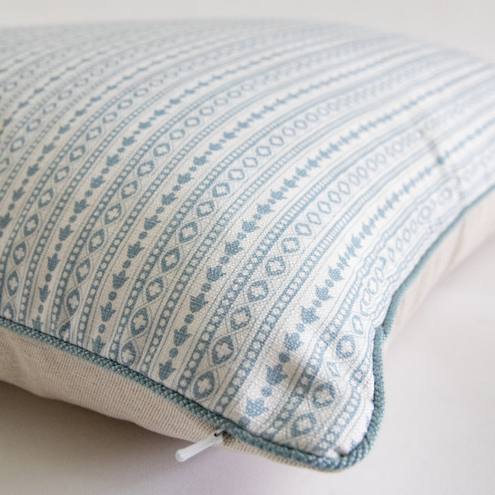 blue geometric stripe pillow with aqua cording