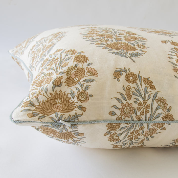 golden blush and blue custom designer pillow with contrast blue cording