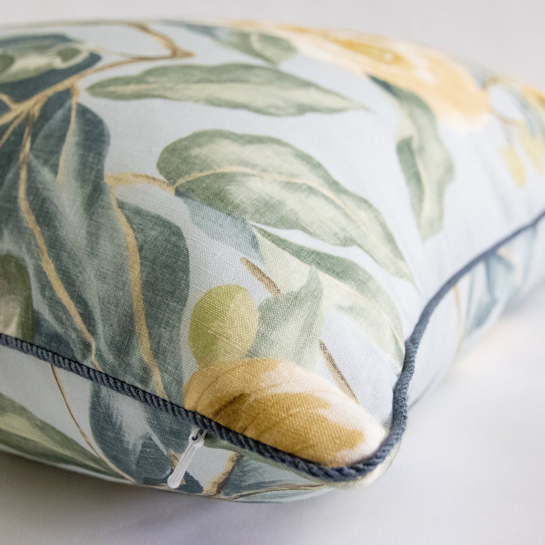 blue and gold camellia floral pillow with blue cording