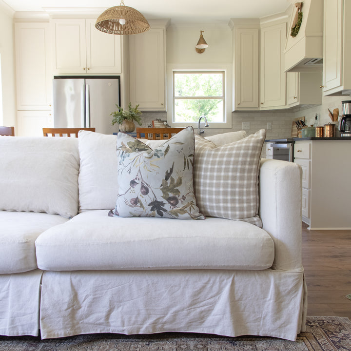 custom designer pillows on sofa made using kelly ventura and Schumacher fabric